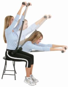 demonstrating the core stretch tool on a chair - a simple back stretcher to prevent lower back pain at work or home office
